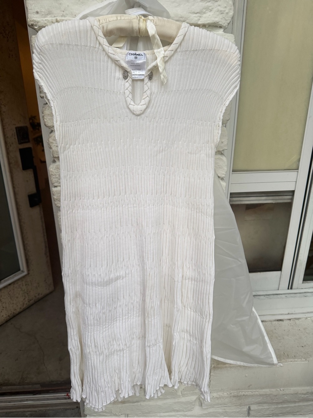 CHANEL Cream Ribbed Knit Top with Chain Accent